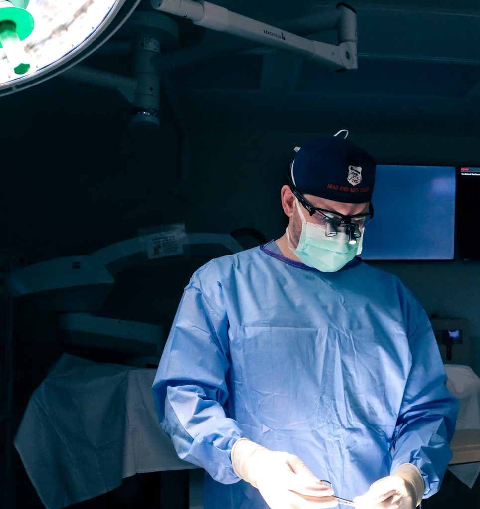 Dr. Tyler Okland performing facial plastic surgery