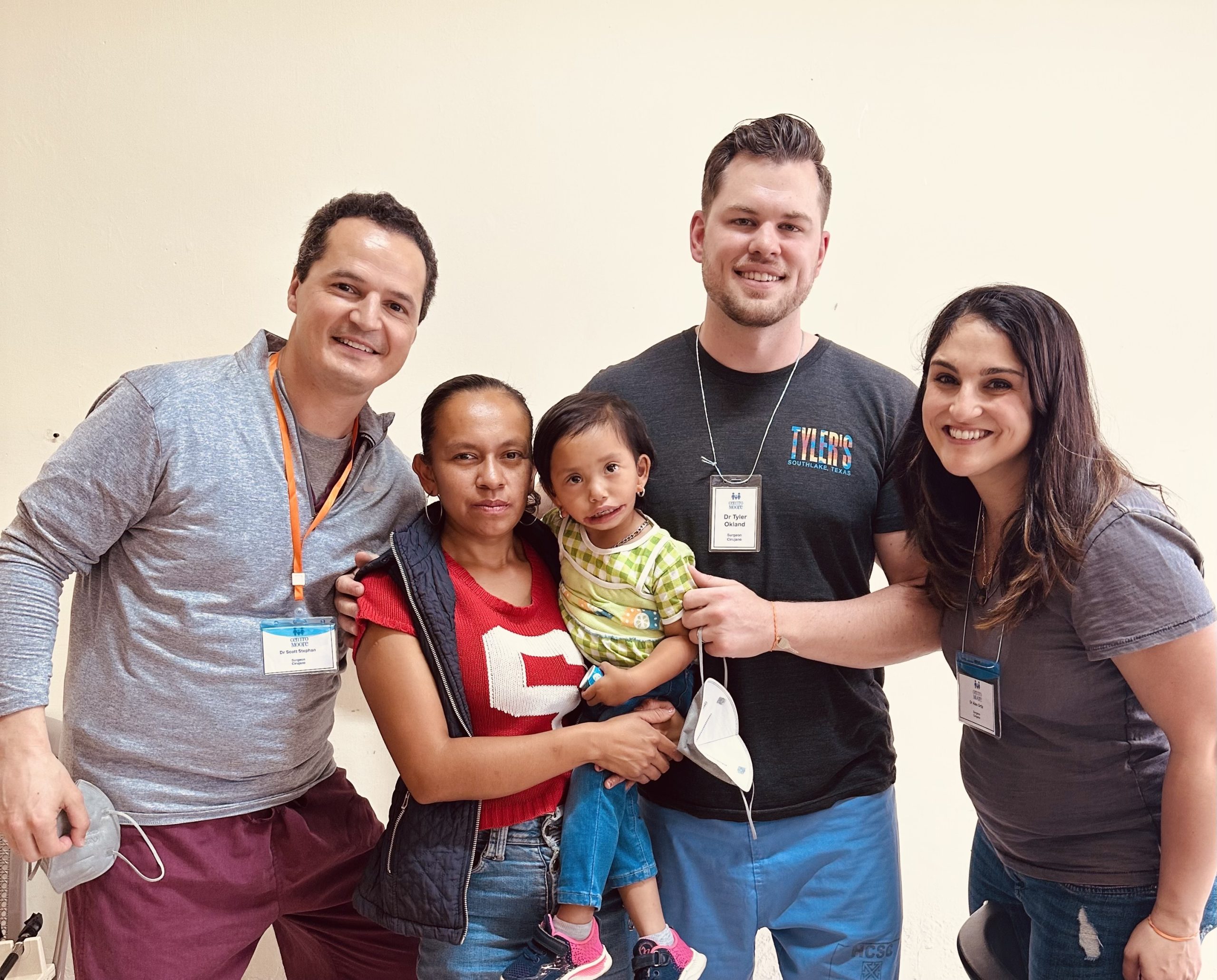 Dr. Tyler Okland with a reconstructive surgery team and patient