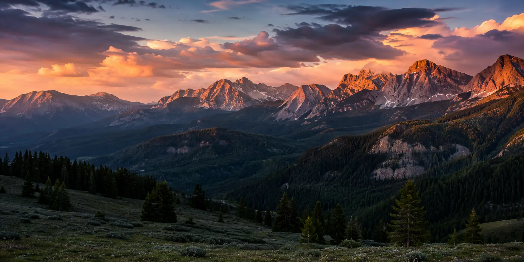 The Colorado Rocky Mountains beneath sunset clouds